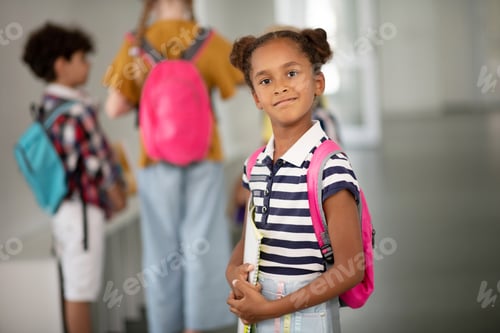 Preview: Girl wearing pink backpack feeling excited before lesson
