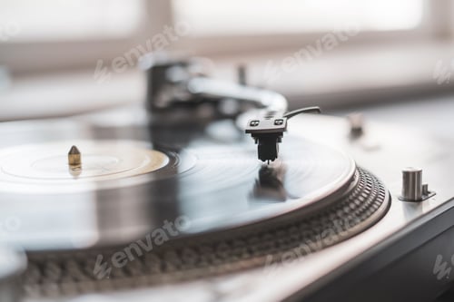 Preview: a macro close up record player needle playing the vinyl disc, old fashioned retro music player