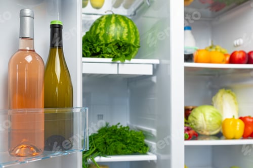 Preview: Open fridge full of fruits, vegetables and drinks