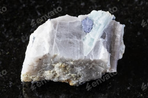 Preview: raw molybdenite nugget in beryl rock on black