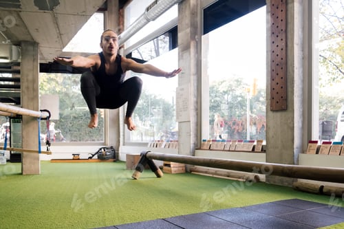 Preview: sportsman training by jumping with knees to chest