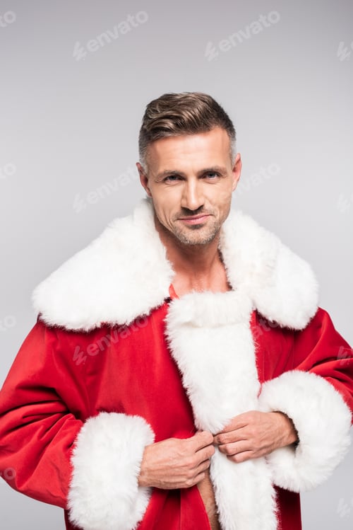 Preview: portrait of handsome man in santa costume smiling at camera isolated on grey