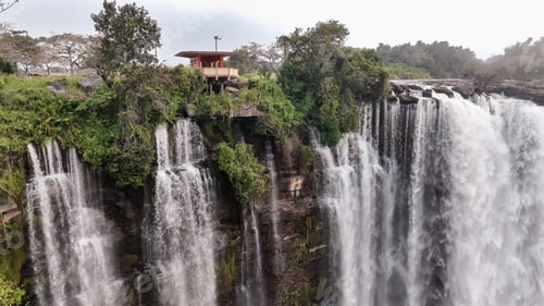 Preview: Kalandula Waterfall cascades in Angola, showcasing powerful water flow and surrounding greenery