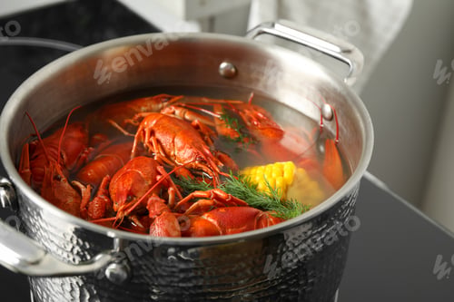 Preview: Fresh delicious crayfishes in pot on stove, closeup