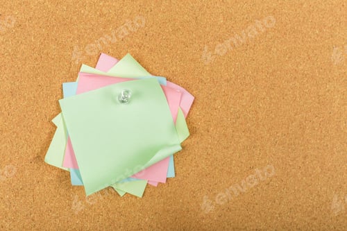 Preview: Colorful sticky notes arranged on a corkboard for reminders and organization