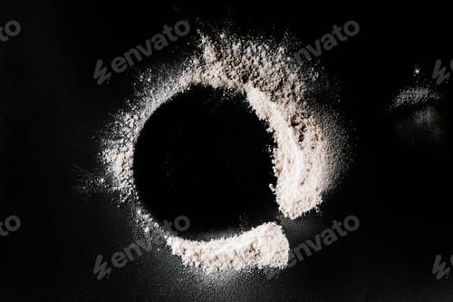 Preview: top view of flour on black tabletop