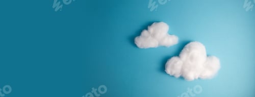 Preview: Pattern of white fluffy clouds made of cotton wool on a blue background
