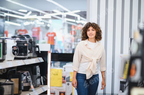 Preview: Customer walking in electronics store choosing home appliances