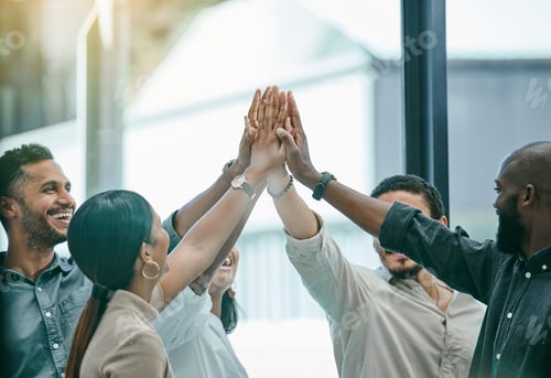 Preview: Im so proud of this team. Shot of a group of coworkers high fiving each other.