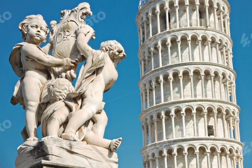 Preview: Tower of Pisa and statue of cherubs winged angels at sunny day, Italy