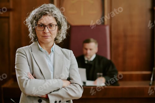 Preview: Portrait of Middle Aged Caucasian Woman Lawyer Standing Confidently in Courtroom
