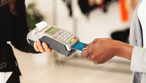 Preview: African American Woman Paying With Credit Card