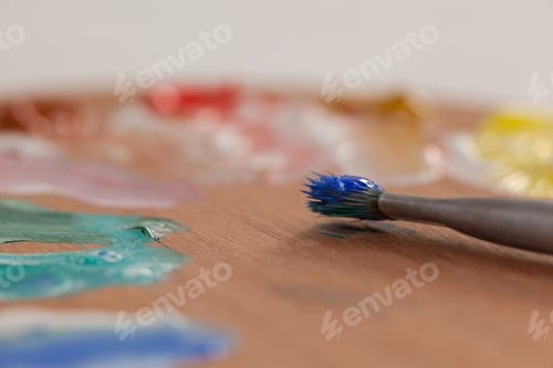 Preview: Paint brush and palette against white background