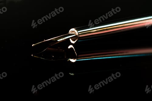 Preview: Close up of a pen on black background