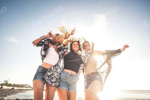 Preview: Three young woman jump for happiness. beauty and fun.