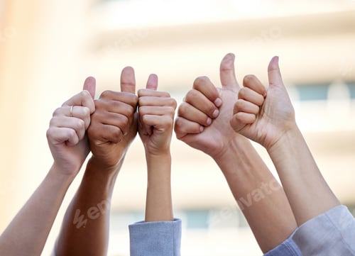 Preview: Your fullest potential is within reach. Shot of a group of business people giving the thumbs up.