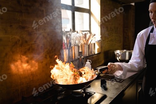 Preview: Caucasian chef cooking with fire