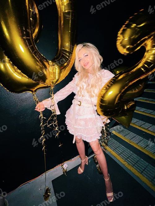 Preview: Beautiful blonde girl celebrating New Year 2022