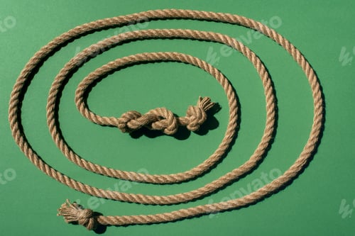 Preview: close-up view of nautical rope with knots on green
