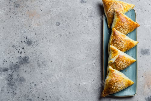 Preview: Delicious samosas samsa with meat, glass of tea on table. East Asian Dish. Ramadan food, top view