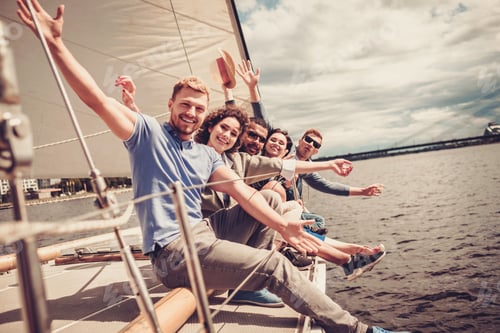 Preview: Happy friends resting on a yacht