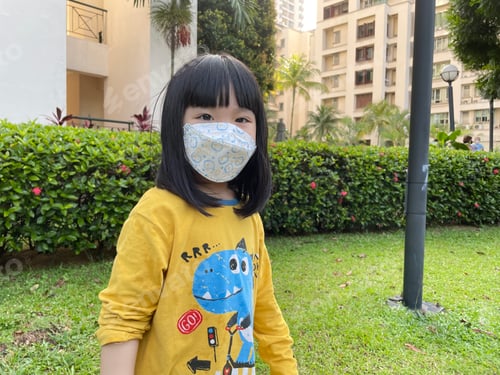 Preview: Happy girl with mask on