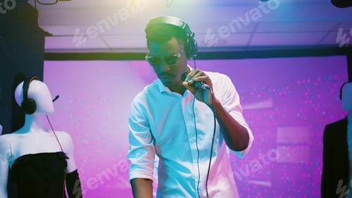Preview: Happy person mixing music at dance party