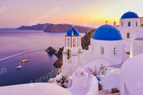 Preview: White churches an blue domes by the ocean of Oia Santorini Greece, traditional Greek village