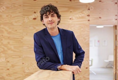 Preview: Confident young man standing in office, portrait