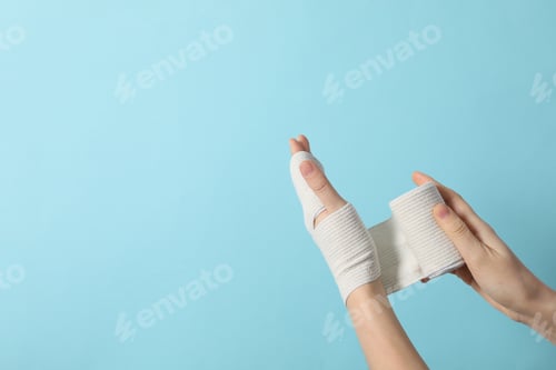 Preview: Concept of hand injury help with elastic bandage