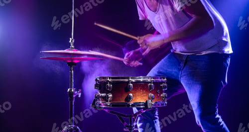 Preview: A drummer plays drums on a blue background.