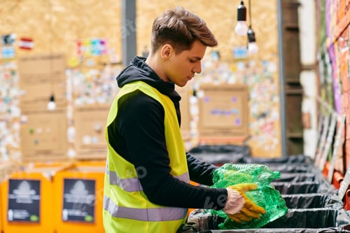 Man Sorting Plastic Bottles for Recycling