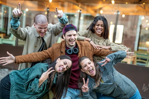 Preview: Multicultural cheerful friends taking selfie pic with smart mobile phone device
