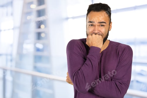 Preview: Black anxious stressed young man looking at camera