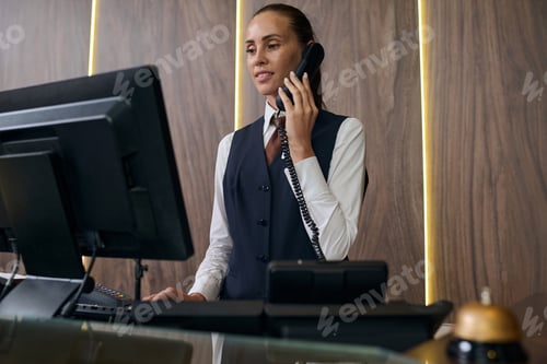 Preview: Manager registrating guest by the phone