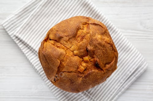 Preview: Homemade Italian Panettone with Raisins and Large Pieces of Candied Fruit, top view.
