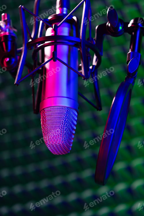 Preview: Professional studio microphone against acoustic foam panel background in neon light