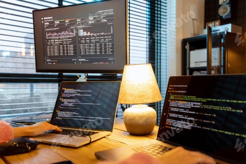 Preview: Female programmer writing programming code at cozy home workplace