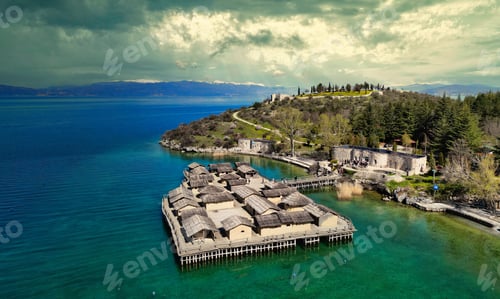 Preview: Aerial view of wooden structures on the shore with lush greenery. Ohrid, Macedonia.