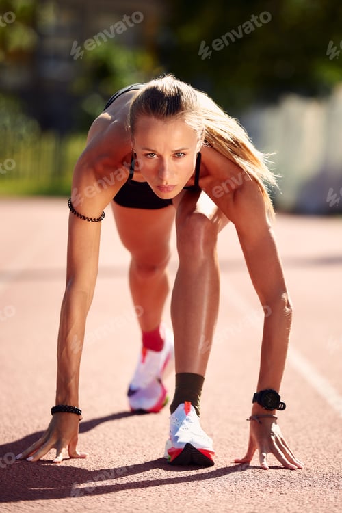 Preview: Woman runner athlete, warming up at the stadium.