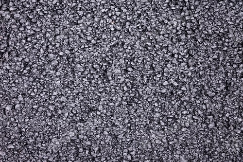 Preview: Fresh Asphalt Concrete Laid on City Street Symbolizes Ongoing Urban Development and Renewal
