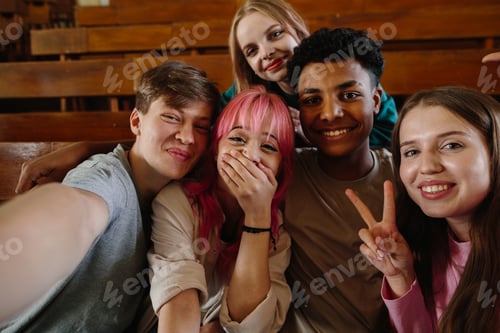 Preview: Group of Friends Celebrating and Smiling Together in a School Classroom