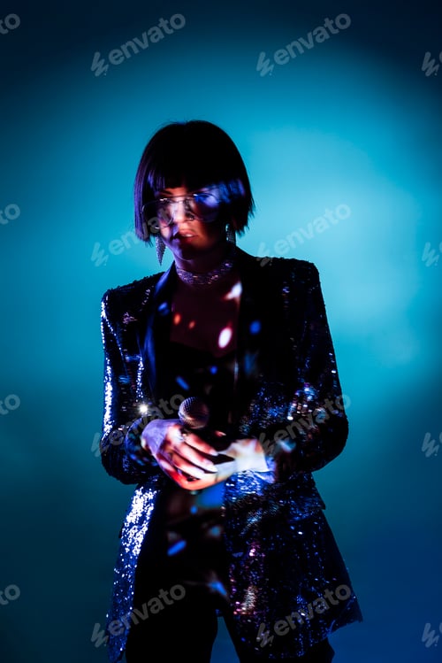 Preview: Stylish woman singing on stage
