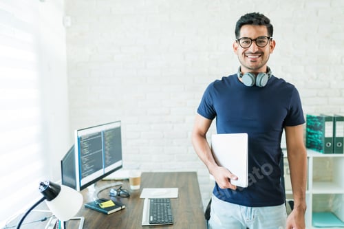 Preview: Attractive Male Programmer Working At Home