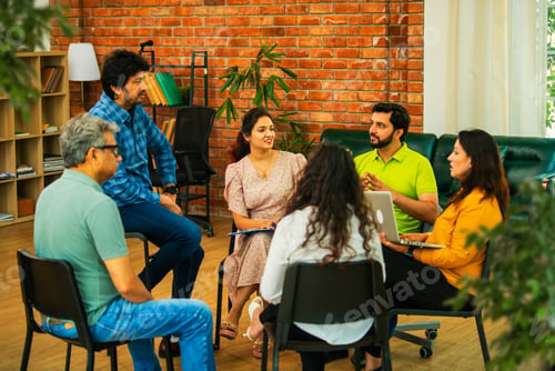 Preview: Diverse Indian startup team collaborating on mental health workplace wellness in a business meeting