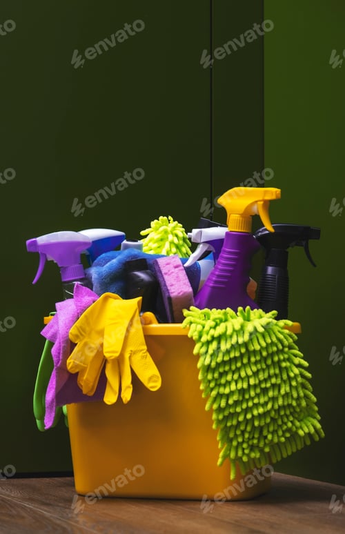 Preview: yellow container with various cleaning sprays, gloves, and cloths, ready for home cleaning tasks