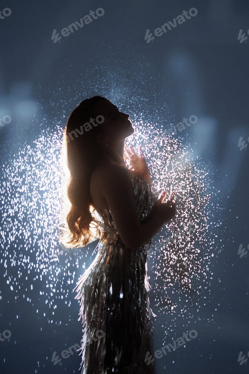 Preview: Glamorous Woman in Sparkling Light and Falling Glitter