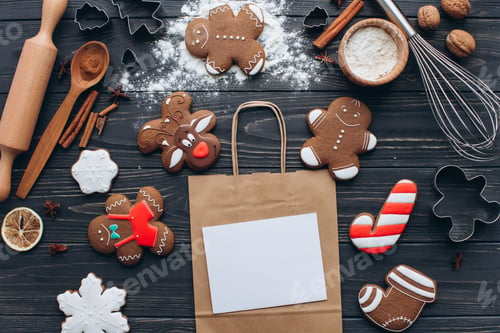 Preview: Festive Gingerbread Cookies and Baking Ingredients On Table