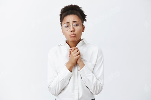 Preview: Please I beg you. Gloomy cute and timid african-american with hair combed, pursing lips, frowning, h