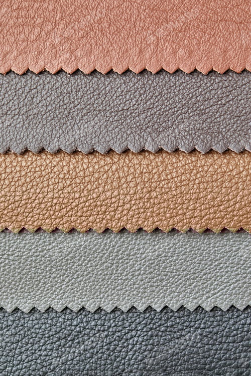 Preview: Samples of beige, brown, gray black leather. Leather crafts and craftwork. View from above.